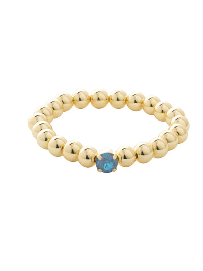 Single Crystal Stretch Bracelet - 4BFJ21BGOCD - <p>Single Crystal Stretch Bracelet features repeating metal beads and a single round cut crystal on a multi-layered stretchy jewelry filament, creating a durable and trendy piece. From Sorrelli's Ocean Delite collection in our Bright Gold-tone finish.</p>