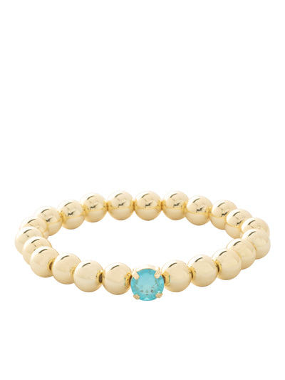 Single Crystal Stretch Bracelet - 4BFJ21BGSBD - <p>Single Crystal Stretch Bracelet features repeating metal beads and a single round cut crystal on a multi-layered stretchy jewelry filament, creating a durable and trendy piece. From Sorrelli's Summer Blue Delite collection in our Bright Gold-tone finish.</p>