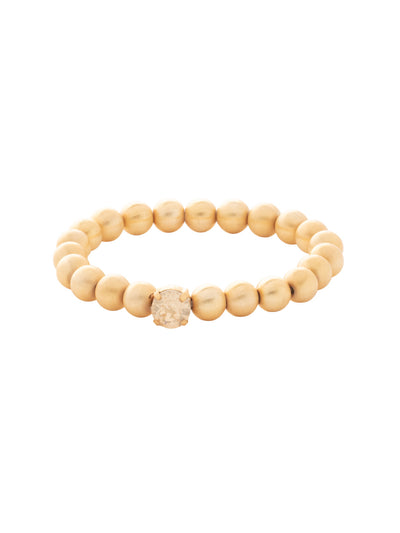 Single Crystal Stretch Bracelet - 4BFJ21MGGGO - <p>Single Crystal Stretch Bracelet features repeating metal beads and a single round cut crystal on a multi-layered stretchy jewelry filament, creating a durable and trendy piece. From Sorrelli's Golden Goddess collection in our Matte Gold-tone finish.</p>