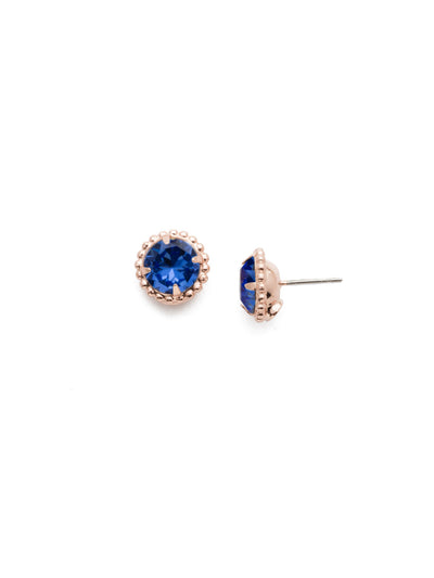 Simplicity Stud Earrings - EBY38RGSAP - <p>A timeless classic, the Simplicity Stud Earrings feature round cut crystals in a variety of colors; accented with a halo of metal beaded detail. Need help picking a stud? <a href="https://www.sorrelli.com/blogs/sisterhood/round-stud-earrings-101-a-rundown-of-sizes-styles-and-sparkle">Check out our size guide!</a> From Sorrelli's Sapphire collection in our Rose Gold-tone finish.</p>