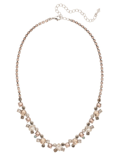 Perfect Harmony Line Tennis Necklace - NDK11PDSNB - <p>This classic line necklace features stations of crystal clusters alternating between round cut and pear shaped central stones, blending in perfect harmony! A rhinestone chain completes this design with all around sparkle. From Sorrelli's Snow Bunny collection in our Palladium finish.</p>