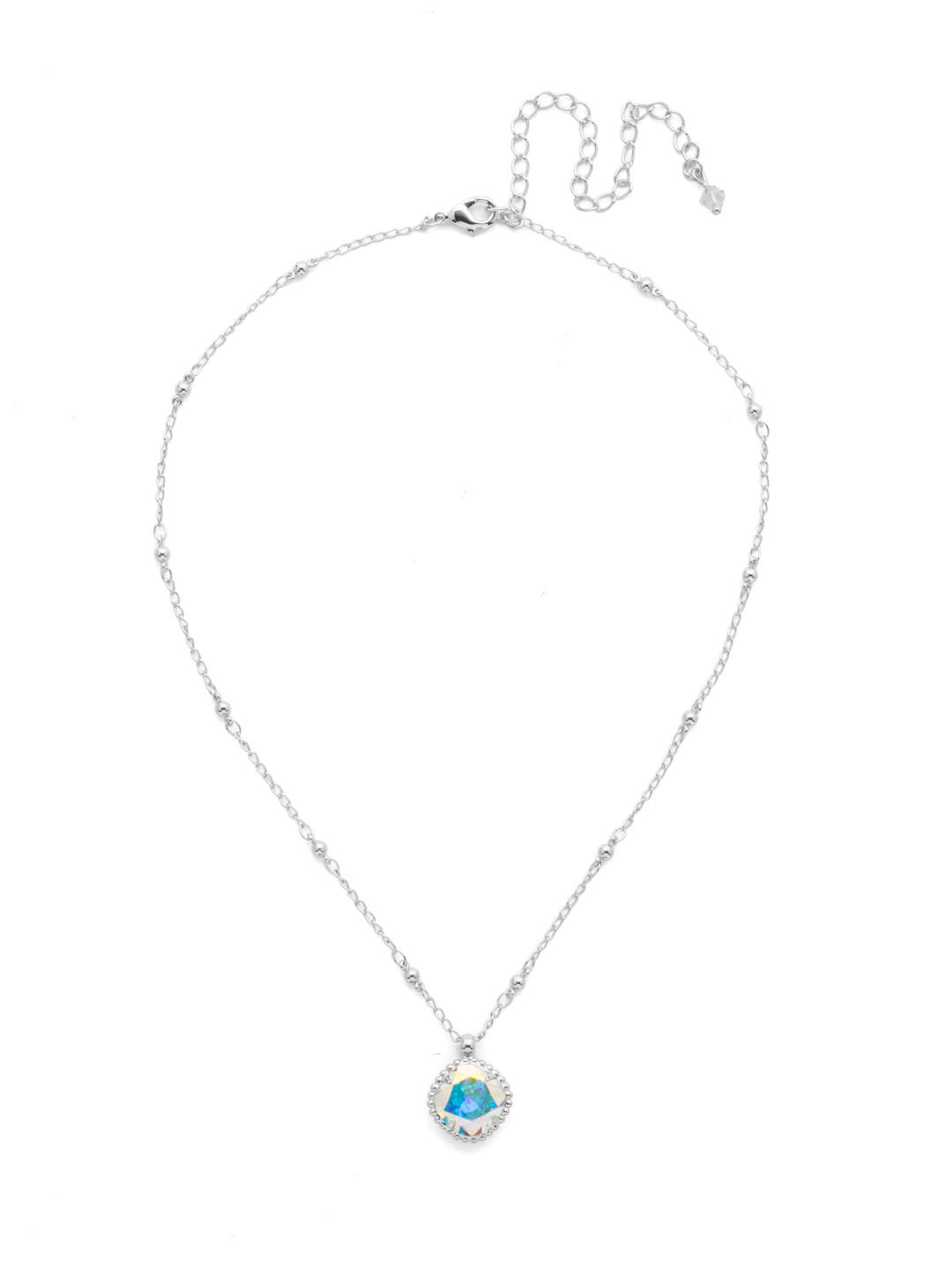 Cushion-Cut Pendant Necklace - NDS50PDCAB - <p>Elevate your jewelry collection with this artisanally handcrafted pendant necklace. The solitaire 12mm cushion cut crystal is surrounded by a beautifully scalloped edge, creating a unique and eye-catching design. The little ball details along the chain add a touch of character. This adjustable necklace features a 16 inch chain with a 4 inch extension, complete with a delicate charm, for a versatile fit. Whether you're looking for a special gift or a treat for yourself, this handcrafted necklace is a stylish and timeless choice. From Sorrelli's Crystal Aurora Borealis collection in our Palladium finish.</p>