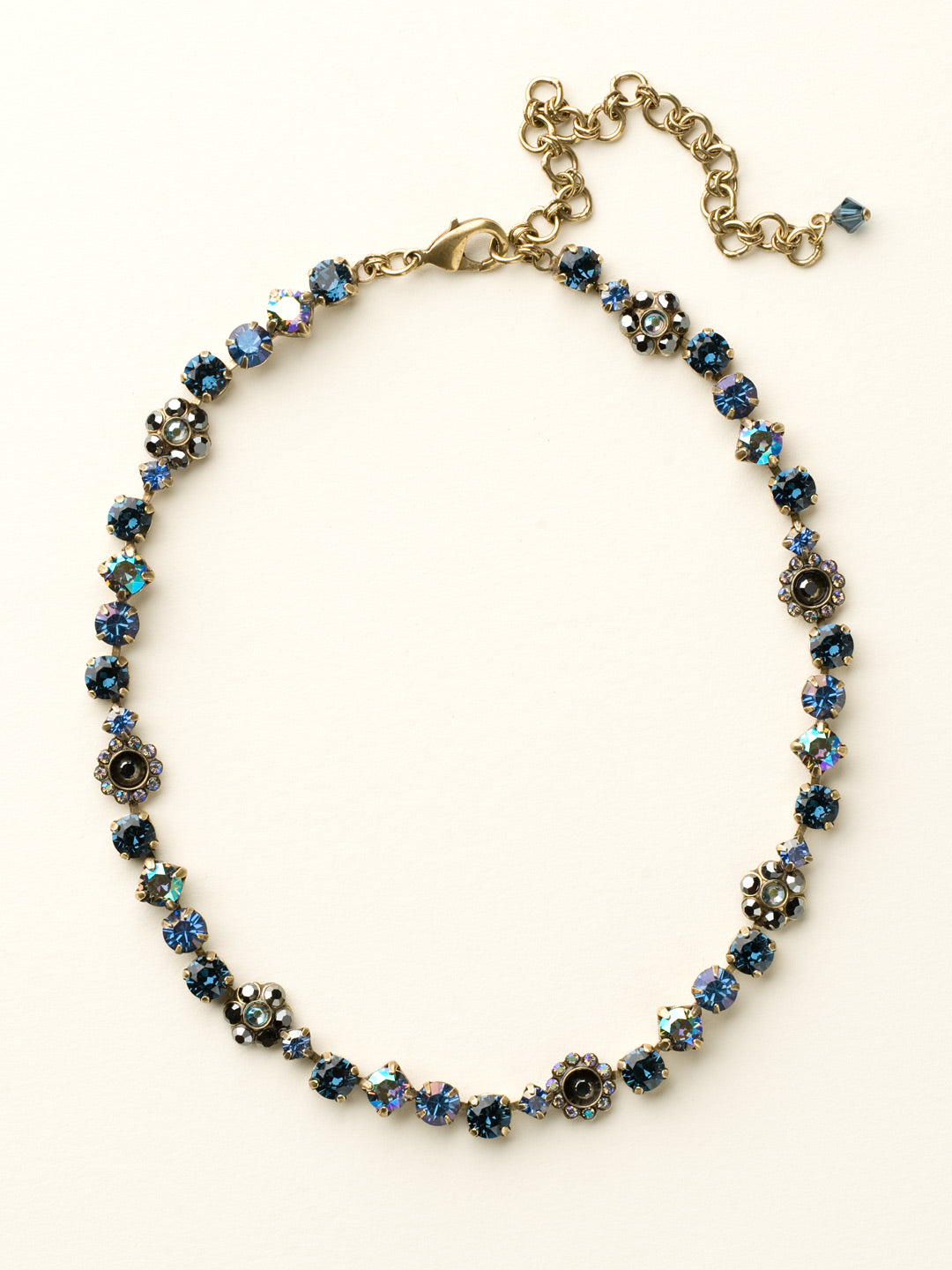 Classic Floral Tennis Necklace - NBE2AGDBL - <p>Put an extra spring in your step! This classic necklace features a combination of round and floral cluster crystals to add a sweet romantic touch to your everyday look. From Sorrelli's Dress Blues collection in our Antique Gold-tone finish.</p>