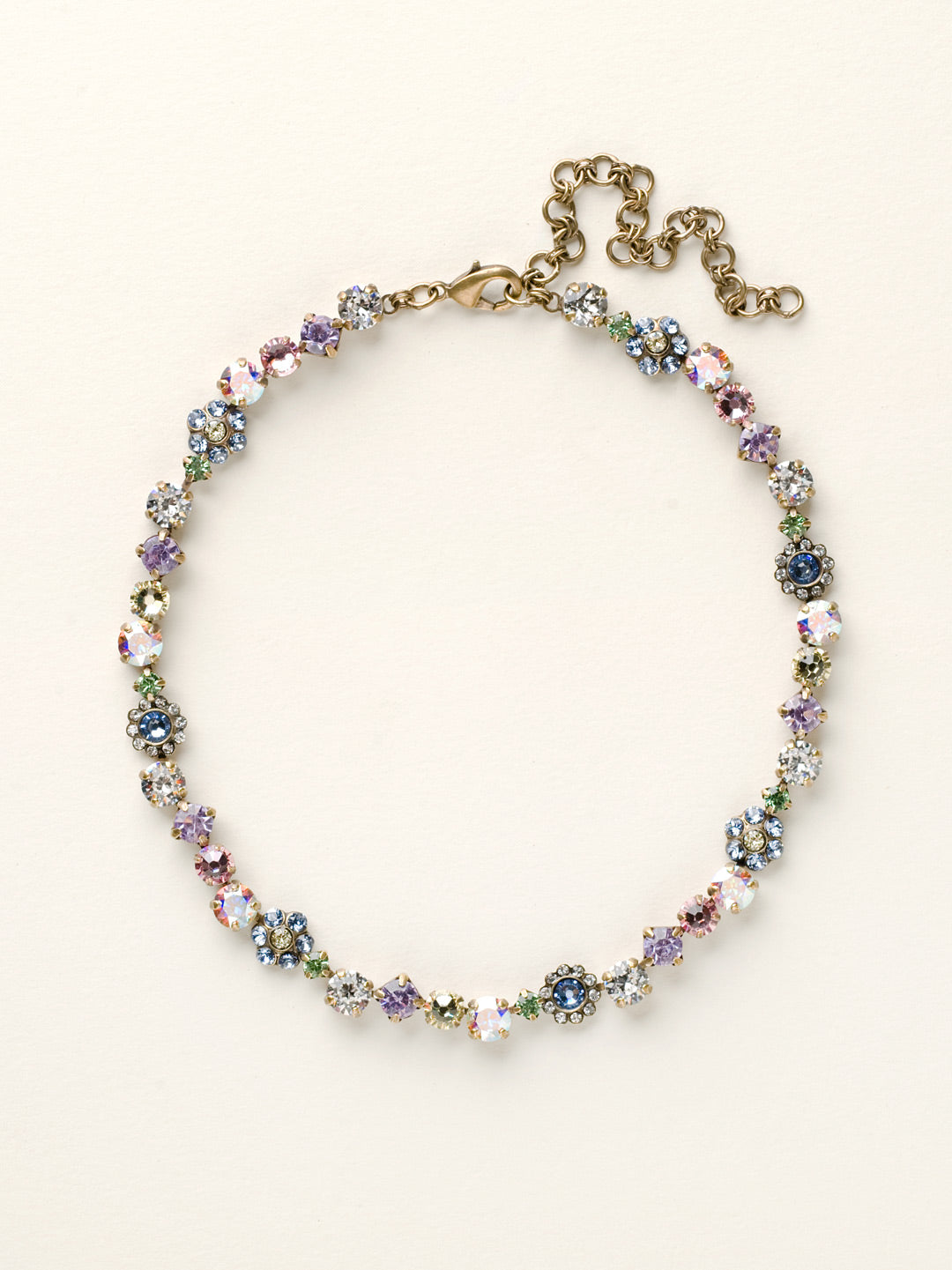 Classic Floral Tennis Necklace - NBE2AGSPR - <p>Put an extra spring in your step! This classic necklace features a combination of round and floral cluster crystals to add a sweet romantic touch to your everyday look. From Sorrelli's Spring Rain collection in our Antique Gold-tone finish.</p>