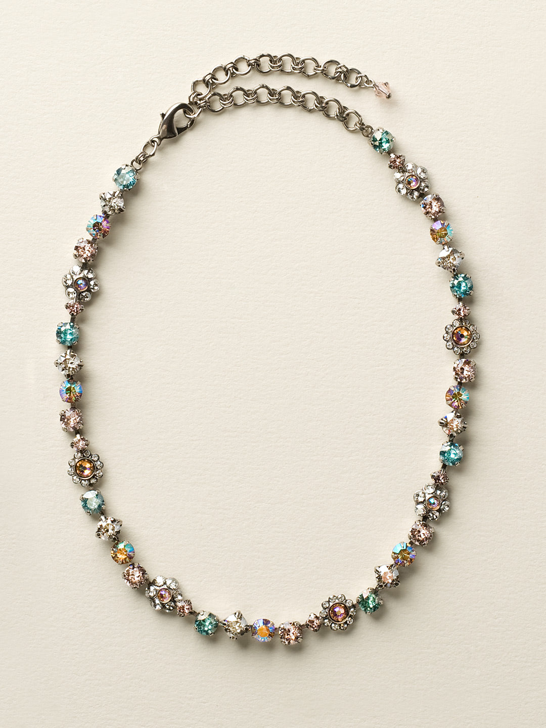 Classic Floral Tennis Necklace - NBE2ASSKY - <p>Put an extra spring in your step! This classic necklace features a combination of round and floral cluster crystals to add a sweet romantic touch to your everyday look. From Sorrelli's Sky Blue Peach collection in our Antique Silver-tone finish.</p>