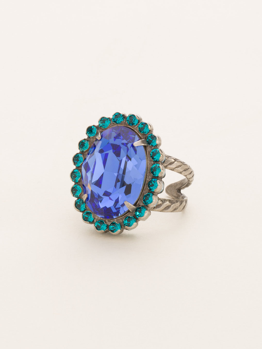 Glamorous Oval-Cut Cocktail Ring - RBT68ASEB - <p>A jewelry collection must! This glamorous ring features a bold oval cut center crystal surrounded by crystal accents that sits on a braided band to create an antique classic. Ring size: 7 (US) From Sorrelli's Electric Blue collection in our Antique Silver-tone finish.</p>