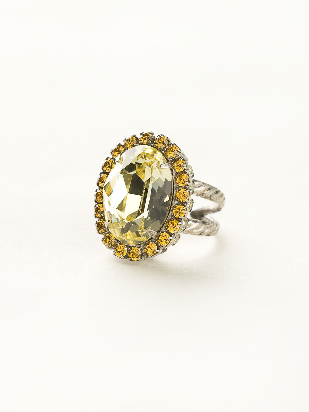 Glamorous Oval-Cut Cocktail Ring - RBT68ASLMD - <p>A jewelry collection must! This glamorous ring features a bold oval cut center crystal surrounded by crystal accents that sits on a braided band to create an antique classic. Ring size: 7 (US) From Sorrelli's Lemonade collection in our Antique Silver-tone finish.</p>