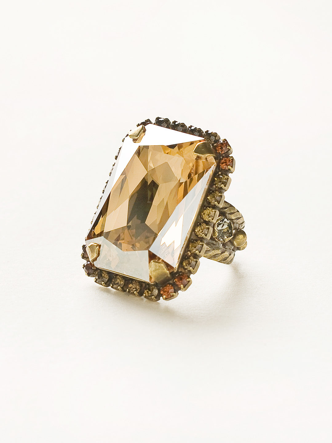 Luxurious Emerald-Cut Cocktail Ring - RBT69AGCN - <p>Big, bold glamour! The large emerald cut crystal of this cocktail ring will leave all eyes on you! Ring size: 7 (US) From Sorrelli's City Neutral collection in our Antique Gold-tone finish.</p>