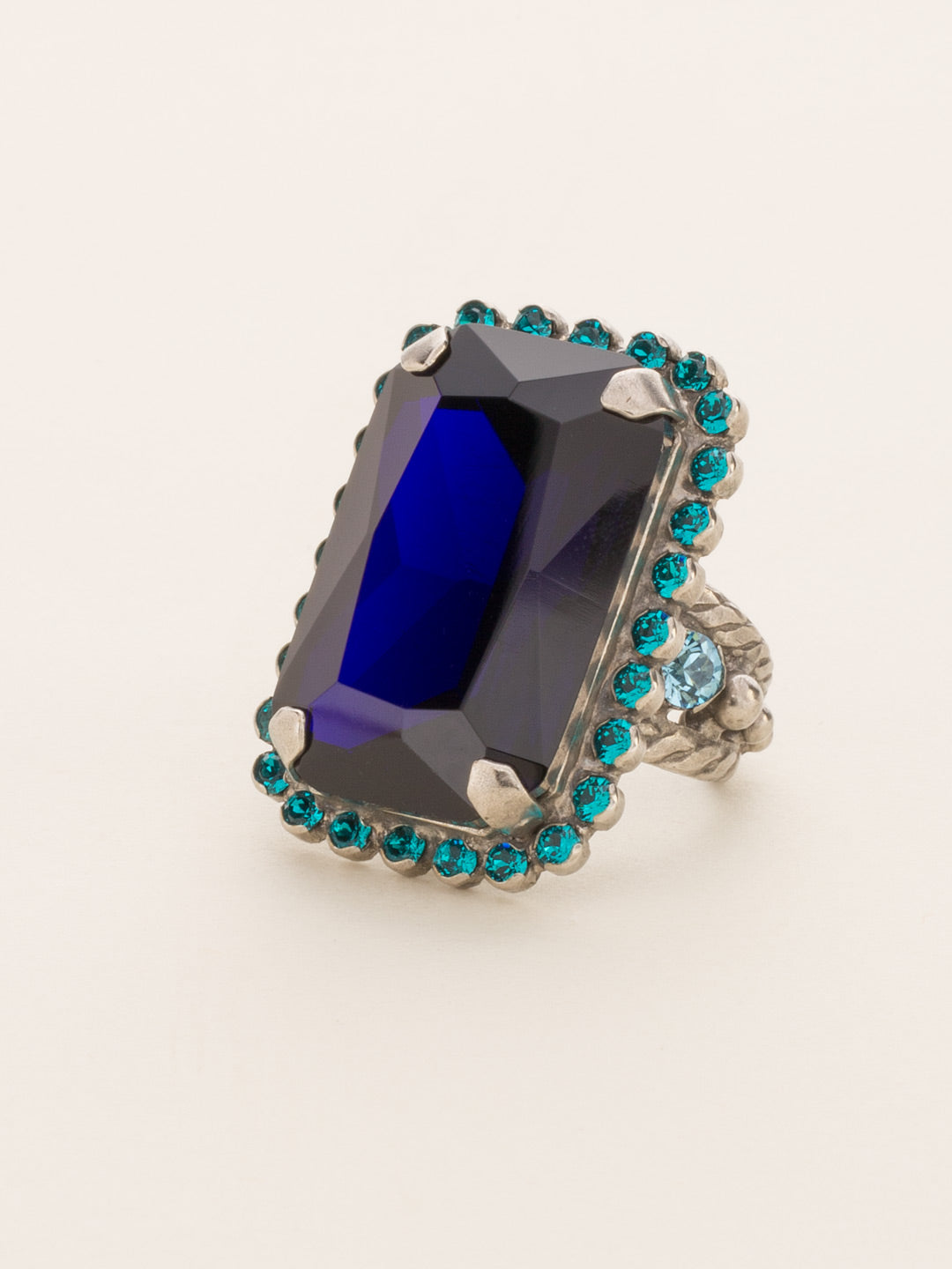 Luxurious Emerald-Cut Cocktail Ring - RBT69ASEB - <p>Big, bold glamour! The large emerald cut crystal of this cocktail ring will leave all eyes on you! Ring size: 7 (US) From Sorrelli's Electric Blue collection in our Antique Silver-tone finish.</p>