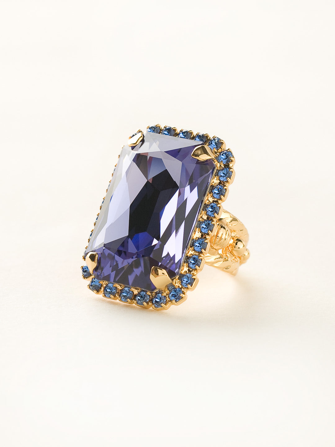 Luxurious Emerald-Cut Cocktail Ring - RBT69BGSS - <p>Big, bold glamour! The large emerald cut crystal of this cocktail ring will leave all eyes on you! Ring size: 7 (US) From Sorrelli's Sweet Sapphire collection in our Bright Gold-tone finish.</p>