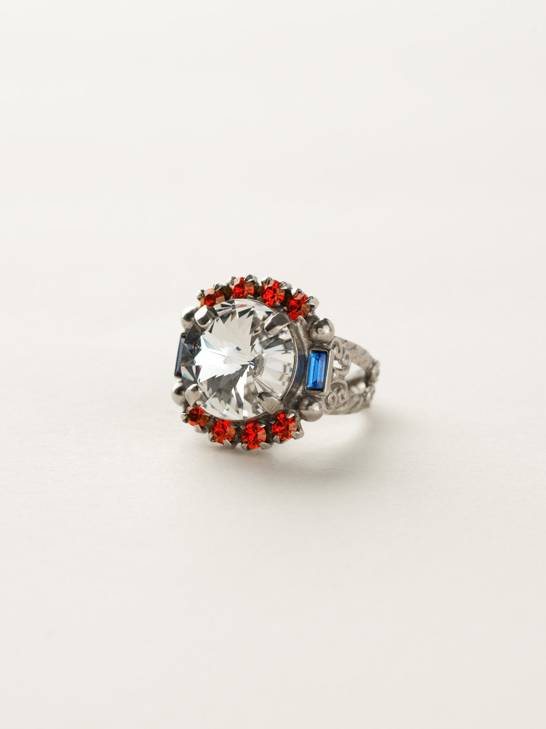 Round Crystal Encrusted Cocktail Ring - RCQ43ASOCR - <p>A large round gemstone surrounded by petite round crystals works as the focal point of this cocktail ring. Which is further accented by an ornate decorative band. Ring size: 7 (US) From Sorrelli's Orange Crush collection in our Antique Silver-tone finish.</p>