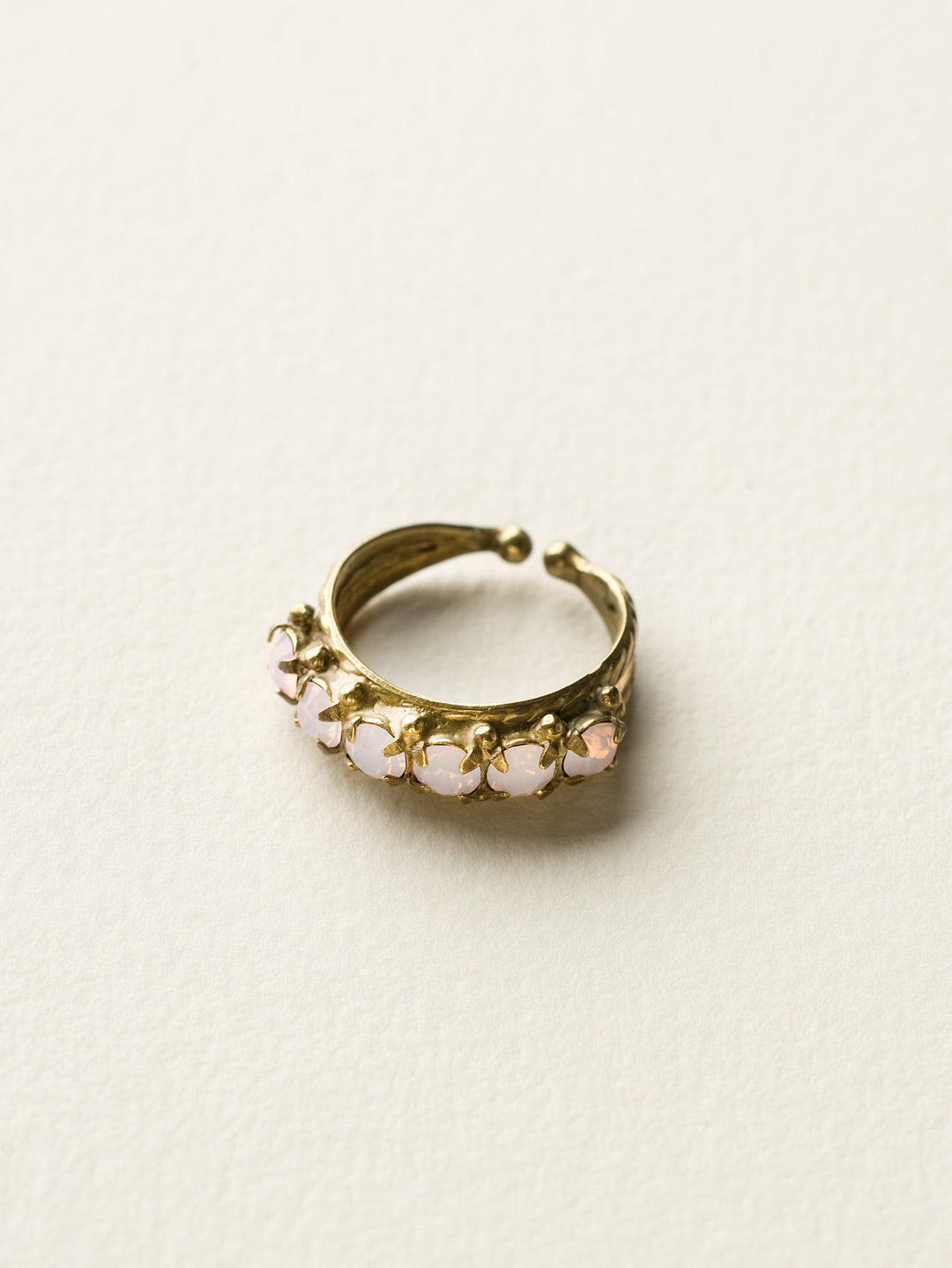 Slim Crystal Cocktail Ring - RCR111AGROW - <p>Small round stones align in a slim ring that is perfect for stacking and layering with others! Wear one or wear some, you can never have too much sparkle! Ring size: 7 (US) From Sorrelli's Rose Water collection in our Antique Gold-tone finish.</p>