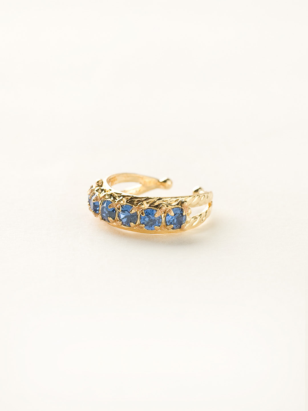 Slim Crystal Cocktail Ring - RCR111BGSS - <p>Small round stones align in a slim ring that is perfect for stacking and layering with others! Wear one or wear some, you can never have too much sparkle! Ring size: 7 (US) From Sorrelli's Sweet Sapphire collection in our Bright Gold-tone finish.</p>