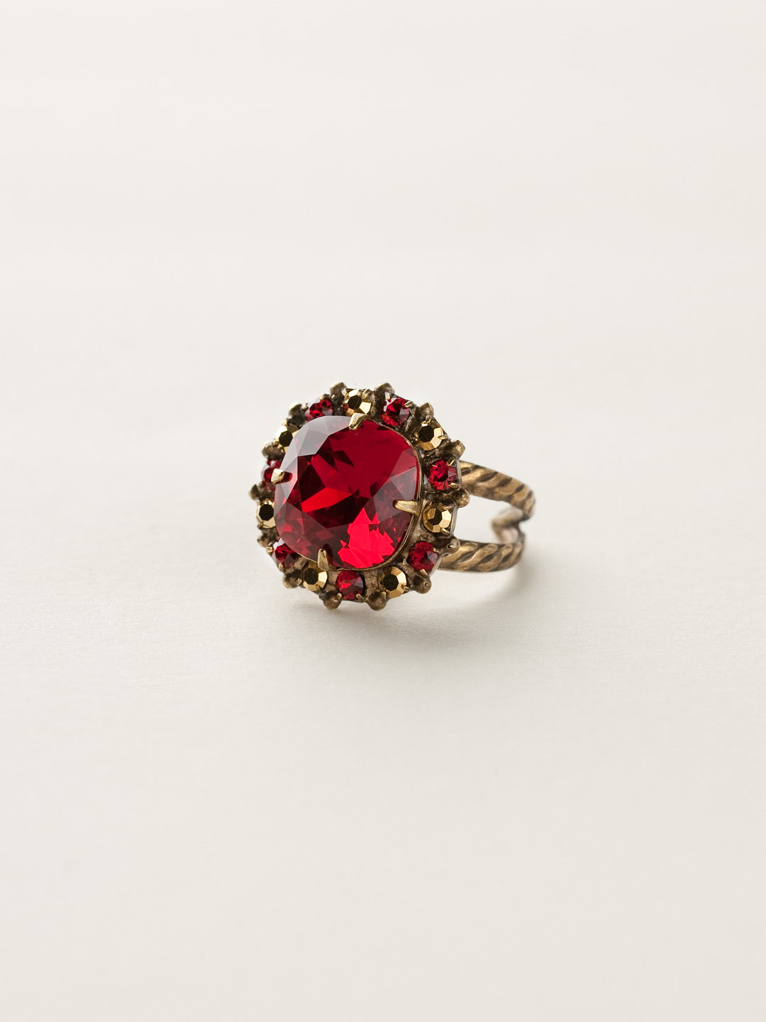 Cushion-Cut Cocktail Ring - RCR112AGGGA - <p>Simply elegant! This classic ring features a central faceted cushion-cut crystal encircled by a row of small round gemstones. Ring size: 7 (US) From Sorrelli's Go Garnet collection in our Antique Gold-tone finish.</p>