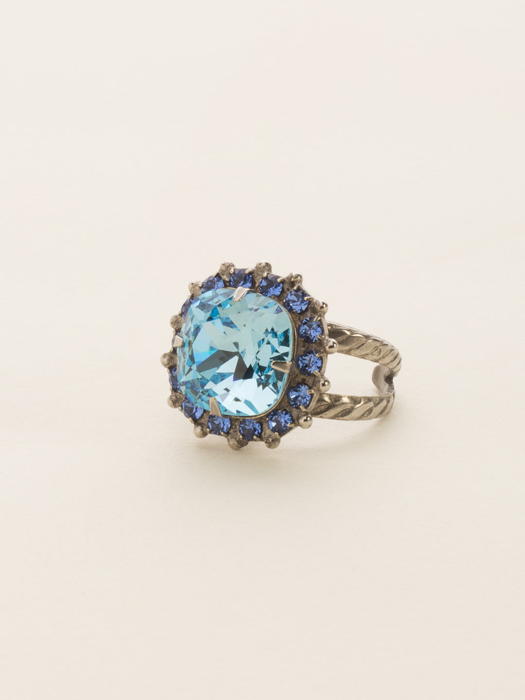 Cushion-Cut Cocktail Ring - RCR112ASEB - <p>Simply elegant! This classic ring features a central faceted cushion-cut crystal encircled by a row of small round gemstones. Ring size: 7 (US) From Sorrelli's Electric Blue collection in our Antique Silver-tone finish.</p>