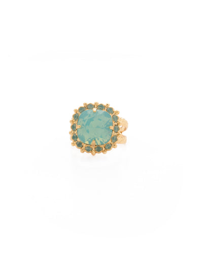 Cushion-Cut Cocktail Ring - RCR112BGPAC - <p>Simply elegant! This classic ring features a central faceted cushion-cut crystal encircled by a row of small round gemstones. Ring size: 7 (US) From Sorrelli's Pacific Opal collection in our Bright Gold-tone finish.</p>