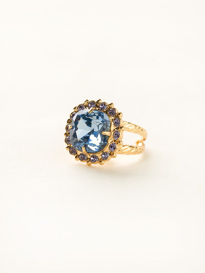 Cushion-Cut Cocktail Ring - RCR112BGSS - <p>Simply elegant! This classic ring features a central faceted cushion-cut crystal encircled by a row of small round gemstones. Ring size: 7 (US) From Sorrelli's Sweet Sapphire collection in our Bright Gold-tone finish.</p>