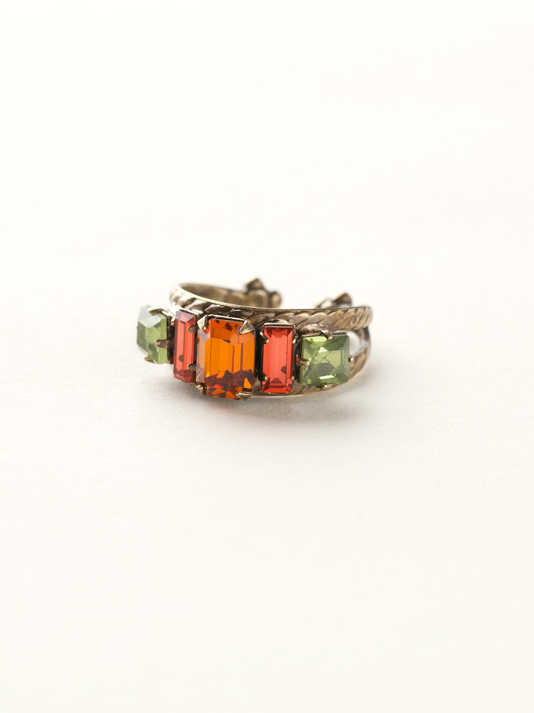 Geometric Crystal Double Band Cocktail Ring - RDA2AGJF - <p>Emerald-cut, baguette, and square crystals all sit in a row on this geometric ring. A braided double band features a decorative metal design. Ring size: 7 (US) From Sorrelli's Juicy Fruit collection in our Antique Gold-tone finish.</p>