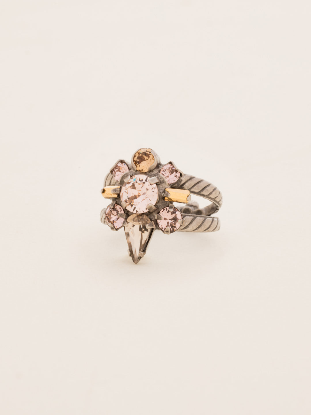 Round Crystal Starburst Cocktail Ring - RDB5ASSND - <p>A cluster of round, teardrop, and baguette cut crystals sit center on this starburst shaped ring. Ring size: 7 (US) From Sorrelli's Sand Dune collection in our Antique Silver-tone finish.</p>