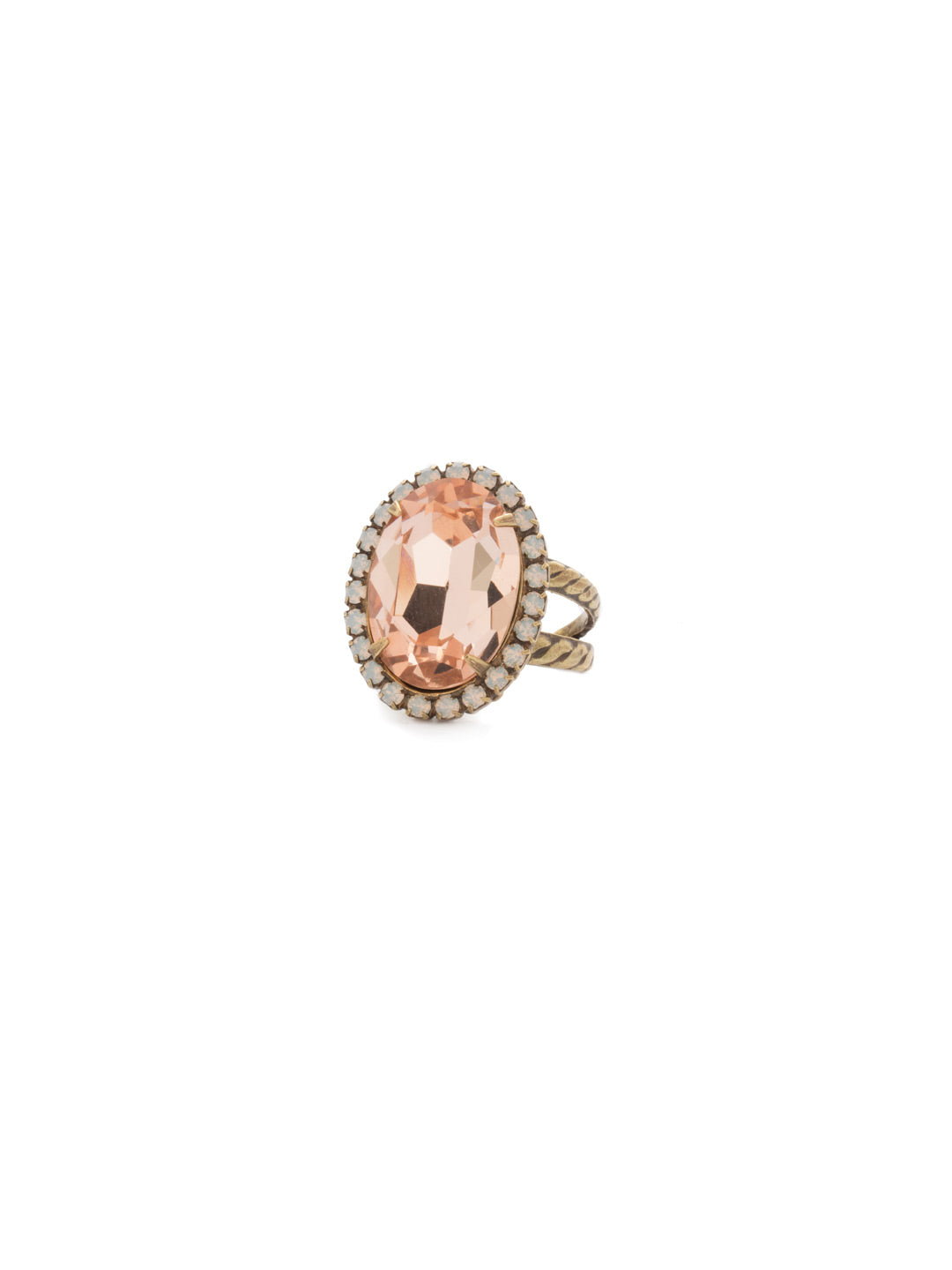 Classic Oval Cut Cocktail Ring - RDG70AGPP - <p>A jewelry collection must! This glamorous ring features a bold oval cut center crystal surrounded by crystal accents that sits on a braided band. An antique-inspired classic. Ring size: 7 (US) From Sorrelli's Pink Peony collection in our Antique Gold-tone finish.</p>