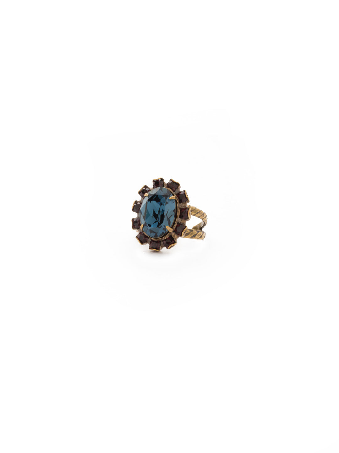 Radiant Oval Cocktail Ring - RDG79AGBBR - <p>A central oval crystal is outlined with petite rounds for a notice-me look. Ring size: 7 (US) From Sorrelli's Blue Brocade collection in our Antique Gold-tone finish.</p>