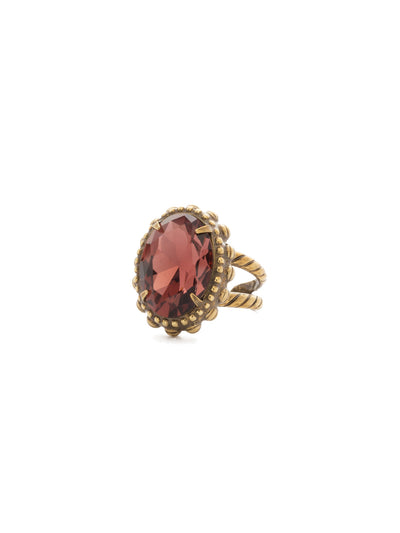 Camellia Cocktail Ring - RDQ7AGM - <p>An elegant oval solitaire with bold metal edging provides high-impact style. Ring size: 7 (US) From Sorrelli's Mahogany collection in our Antique Gold-tone finish.</p>