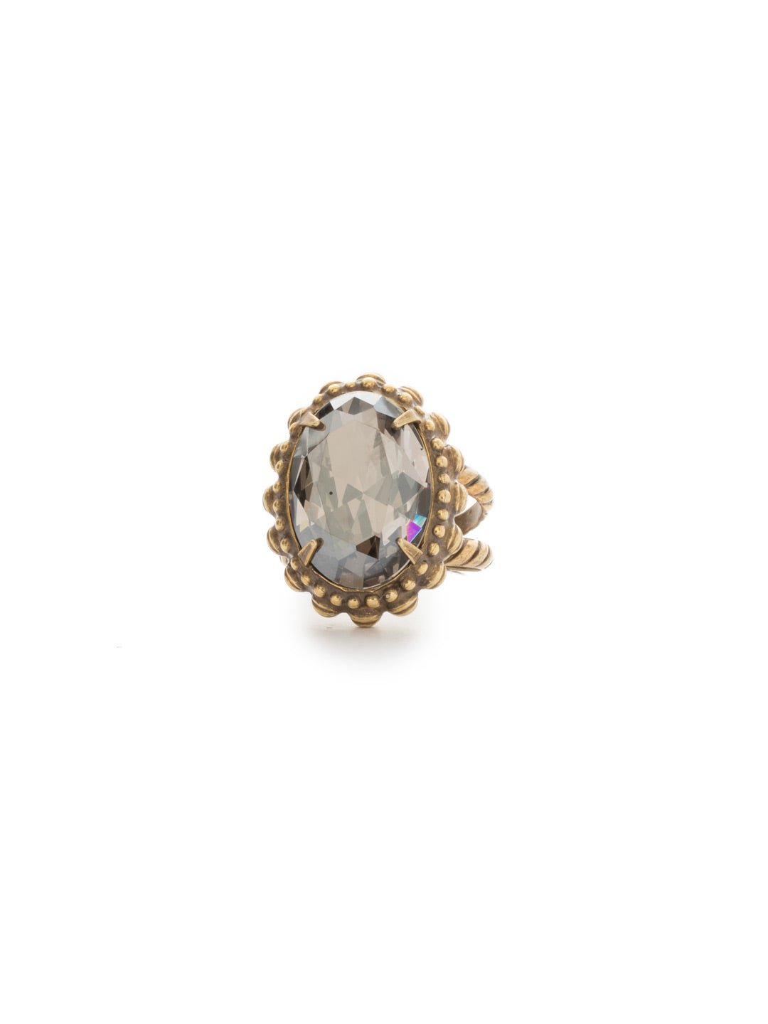 Camellia Cocktail Ring - RDQ7AGWW - <p>An elegant oval solitaire with bold metal edging provides high-impact style. Ring size: 7 (US) From Sorrelli's Washed Waterfront collection in our Antique Gold-tone finish.</p>