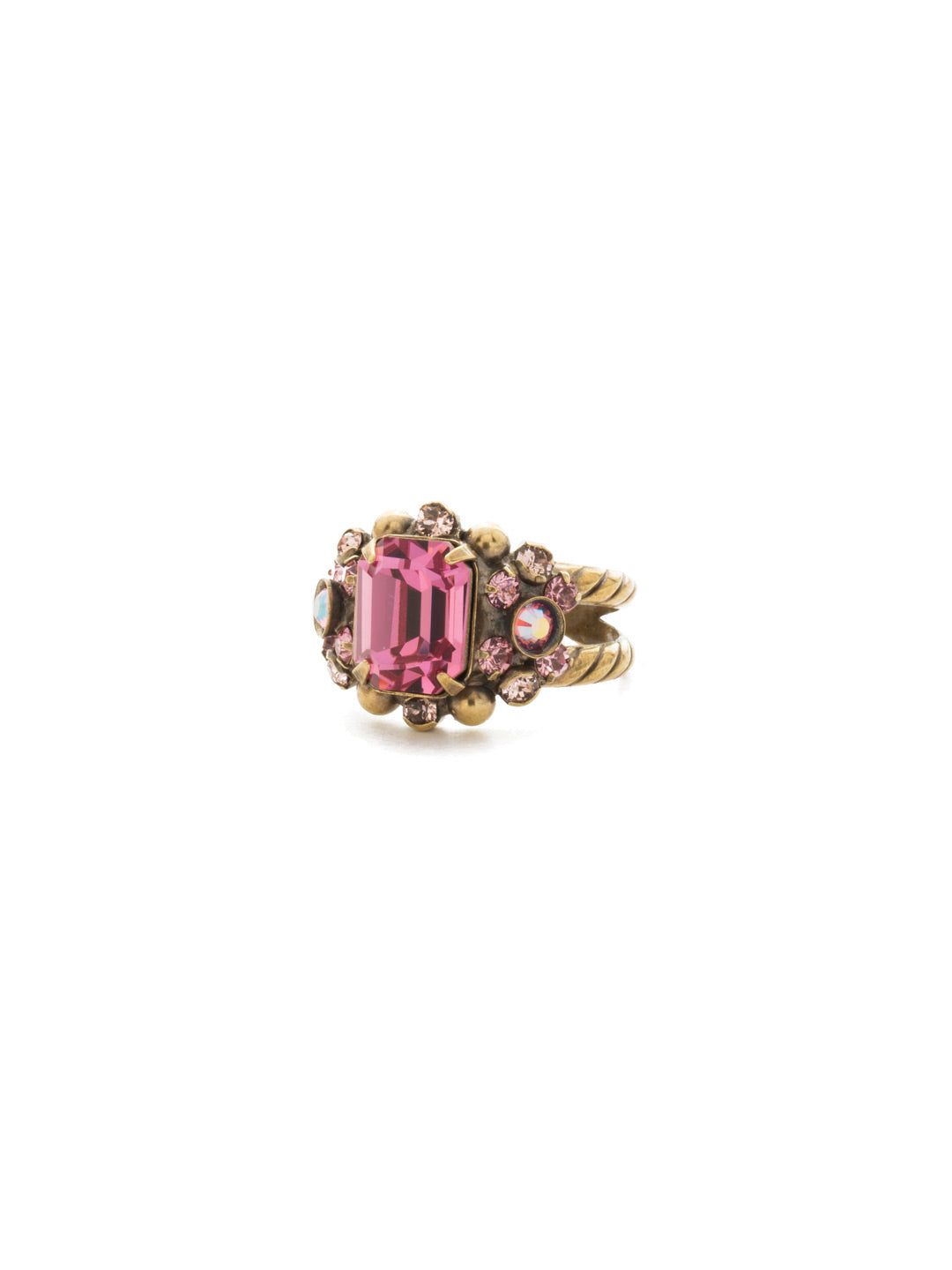 Nightshade Cocktail Ring - RDU54AGPIN - <p>A central emerald cut crystal is surrounded by petite, round stones and set on a detailed double band. Ring size: 7 (US) From Sorrelli's Pink Passion collection in our Antique Gold-tone finish.</p>